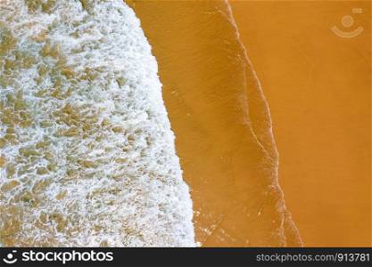 Aerial top shot from ocean waves at the beach