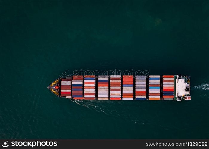 Aerial top view container cargo ship in import export business commercial trade logistic and transportation of international by container cargo ship in the open sea, business service concept