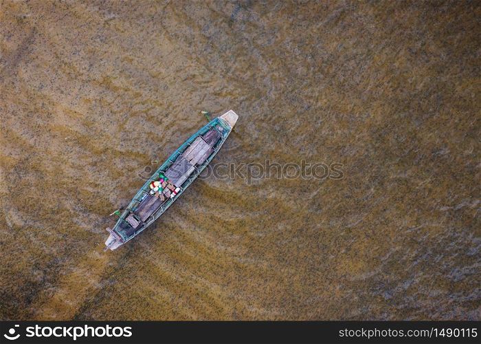 Aerial top view fishing boat traditional at Freshwater lake day time. nature background.