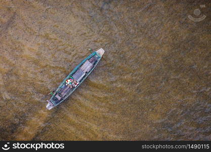 Aerial top view fishing boat traditional at Freshwater lake day time. nature background.