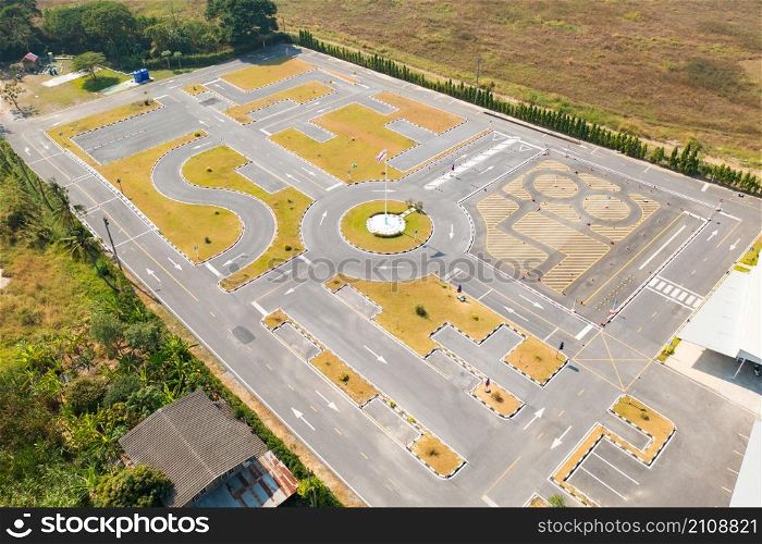 Aerial top view of a car driving test center with street road. Course field, practice vehicle school. Map site design.