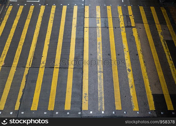 Aerial top view of empty walking street with zebra crossing or pedestrian crossing. Business traffic road in urban city, Hong Kong Downtown, Republic of China.