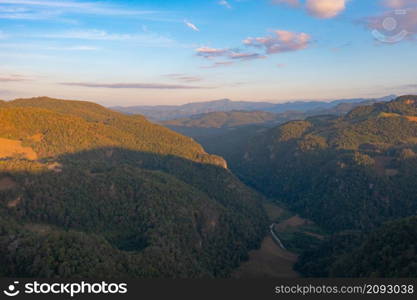 Aerial top view of forest trees and green mountain hills. Nature landscape background, Thailand.