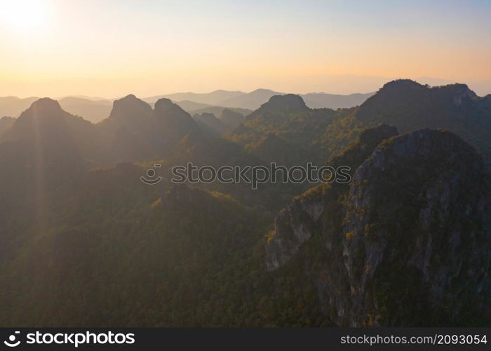 Aerial top view of forest trees and green mountain hills. Nature landscape background, Thailand.