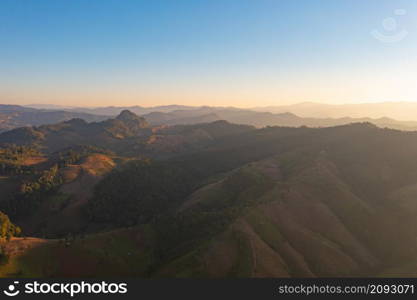 Aerial top view of forest trees and green mountain hills. Nature landscape background, Thailand.