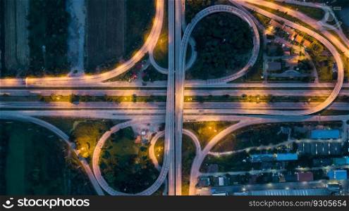 Aerial top view of highway and overpass in city at night, Aerial view of the traffic and intersection road at the city, Highway road junctions at night.