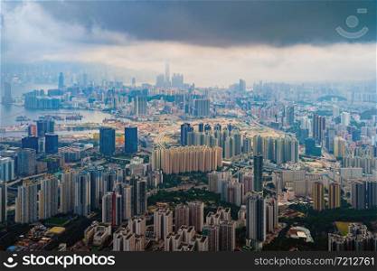 Aerial top view of Hong Kong Downtown, republic of china. Financial district and business centers in smart urban city in Asia. Skyscrapers and high-rise modern buildings at sunset.
