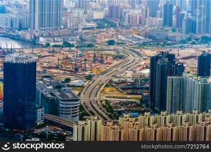 Aerial top view of Hong Kong Downtown, republic of china. Financial district and business centers in smart urban city in Asia. Skyscrapers and high-rise modern buildings at sunset.