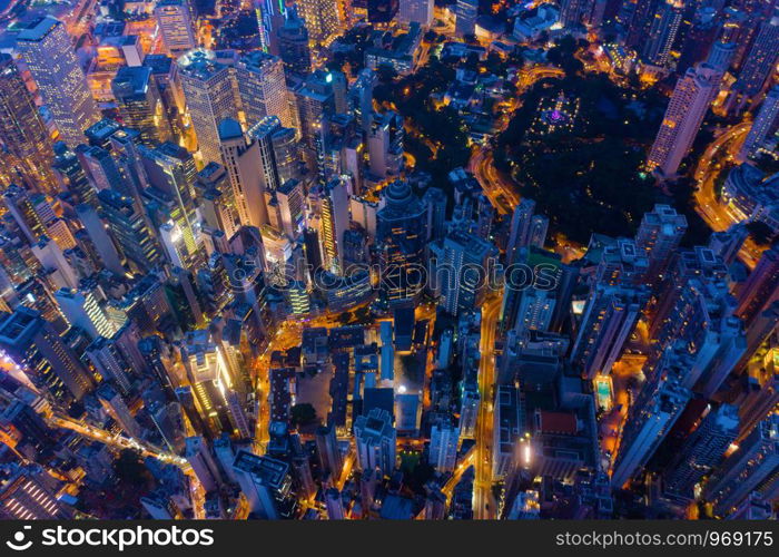 Aerial top view of Hong Kong Downtown, Republic of China. Financial district and business centers in technology smart city in Asia. Top view of skyscraper and high-rise modern buildings at night.