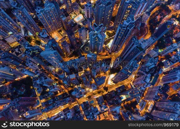 Aerial top view of Hong Kong Downtown, Republic of China. Financial district and business centers in technology smart city in Asia. Top view of skyscraper and high-rise modern buildings at night.