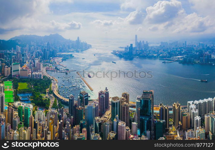 Aerial top view of Hong Kong Downtown, republic of china. Financial district and business centers in smart urban city in Asia. Skyscrapers and high-rise modern buildings at noon.