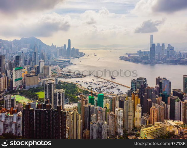 Aerial top view of Hong Kong Downtown, republic of china. Financial district and business centers in smart urban city in Asia. Skyscrapers and high-rise modern buildings at noon.