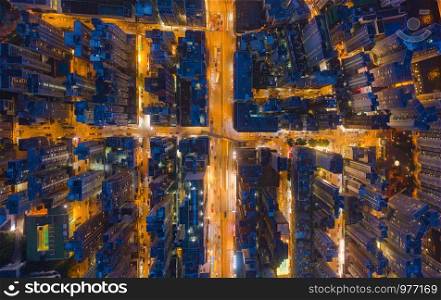 Aerial top view of Hong Kong Downtown, Republic of China. Financial district and business centers in technology smart city in Asia. Top view of skyscraper and high-rise modern buildings at night.
