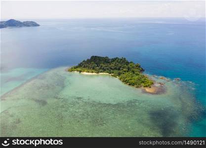 Aerial top view of ocean waves, beach and rocky coastline and beautiful forest. Beautiful nature background. island background and tropical with tourist