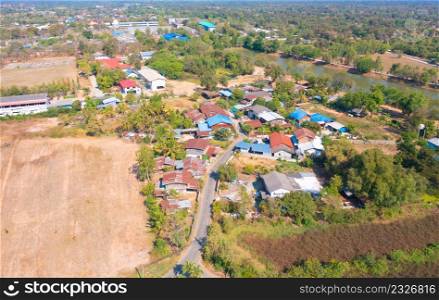 Aerial top view of residential local houses, nature trees, Nonthaburi City, Thailand in urban city town in Asia, buildings.