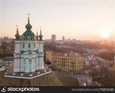 Aerial top view of Saint Andrew&rsquo;s church and Andreevska street, cityscape of Podol district city of Kiev , Ukraine. Drone photo. View of St. Andrew&rsquo;s Church and the historical Podol part of the city Kiev, Ukraine