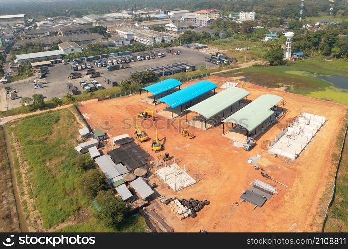 Aerial top view of truck cars parking stock lot row in industry factory, dealer inventory import and export business commercial, Automobile and automotive industry distribution logistic transport