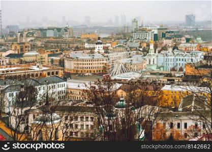 Aerial top view on building roofs of Podil district , Kiev city, Kyiv cityscape, capital of Ukraine. Aerial top view of Podil district , Kiev city, Kyiv cityscape, capital of Ukraine