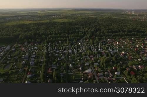 Aerial - Vast territory with summer houses, green woods and plains. Russian countryside landscape
