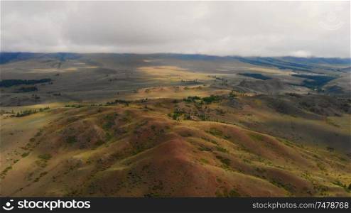 Aerial video of the Kurai steppe between the Kurai and the North Chuia Ranges in the south-eastern Altai, Siberia, Russia. Aerial video of the Kurai steppe