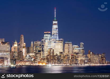 Aerial viee of NYC New York city Lower Manhattan skyscraper skylines building cityscape downtown at sunser dusk from New Jersey. Lower Manhattan is the largest financial district in the world.