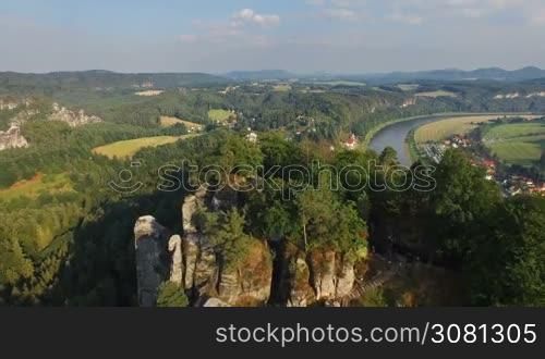 Aerial view a magnificent panoramic view of Bastai in Germany next to the river on a sunny day. On the background beautiful scenic nature.