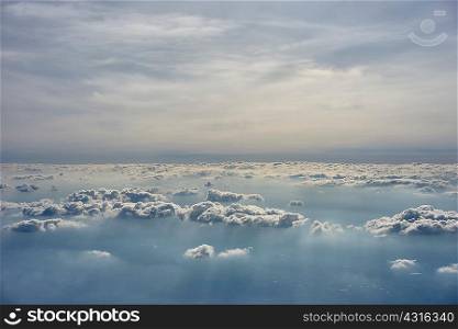 Aerial view above and below clouds