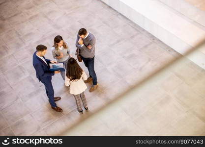 Aerial view at young business people team discussing in the office hallway