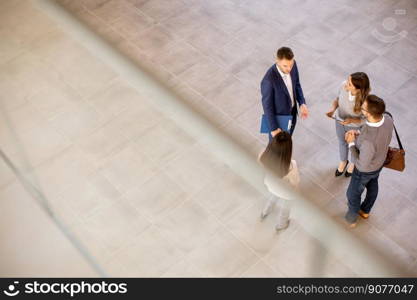 Aerial view at young business people team discussing in the office hallway