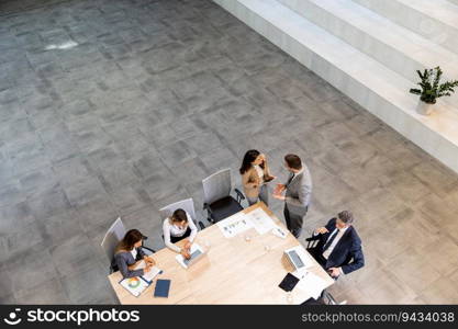 Aerial view at young startup team working in the modern office