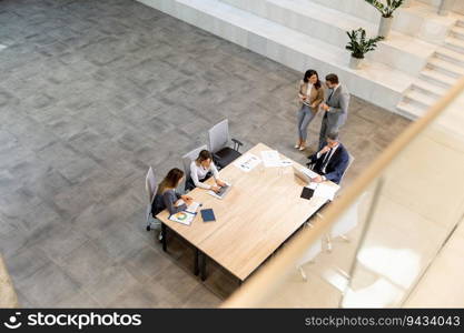 Aerial view at young startup team working in the modern office