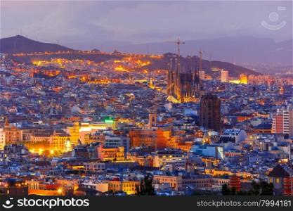 Aerial view Barcelona illuminated from the Montjuic hill at night, Catalonia, Spain.