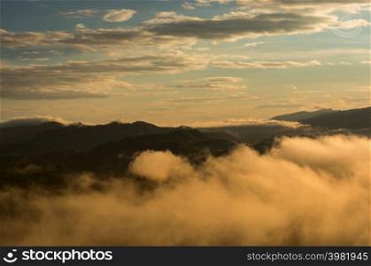 Aerial view Beautiful of morning scenery Golden light sunrise And the mist flows on high mountains, Wonder fog.. Fog in forest.