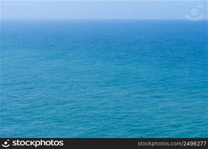Aerial view calm infinite blue ocean water and sky background