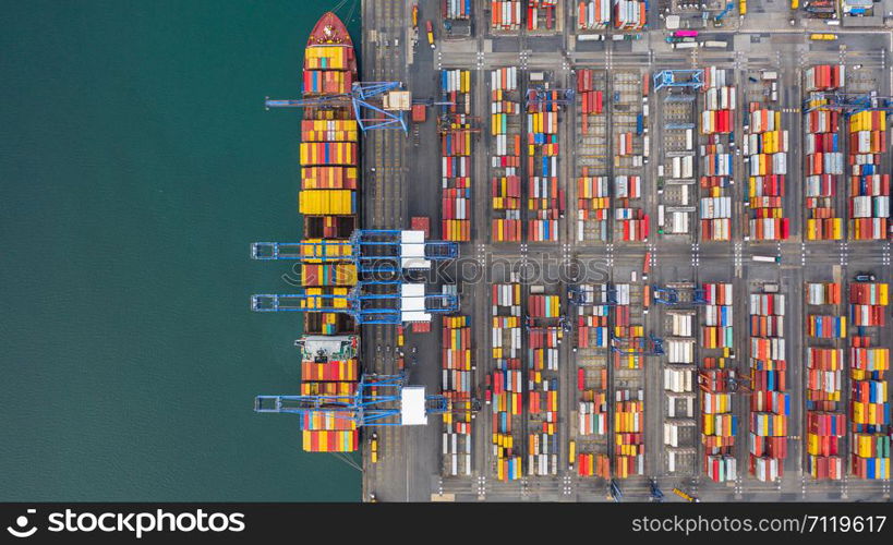 Aerial view cargo ship terminal, Unloading crane of cargo ship terminal, Aerial view industrial port with containers and container ship.