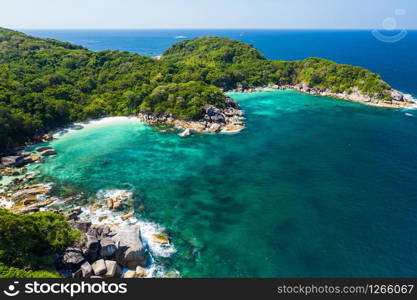 Aerial view drone shot ocean waves, Beautiful tropical beach and rocky coastline and beautiful forest. Nga Khin Nyo Gyee Island Myanmar. Tropical seas and islands in southern Myanmar