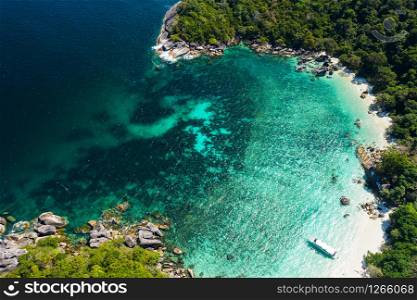 Aerial view drone shot ocean waves, Beautiful tropical beach and rocky coastline and beautiful forest. Nga Khin Nyo Gyee Island Myanmar. Tropical seas and islands in southern Myanmar