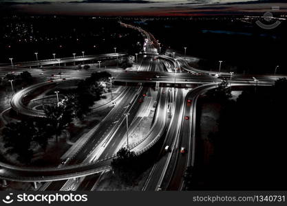 Aerial view Expressway motorway highway circus intersection at Night time Top view , Road traffic in city