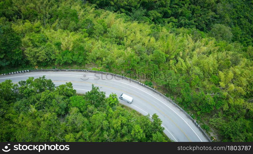 Aerial view forest nature with car on the road on the mountain green tree background, top view road curve from above countryside Asian