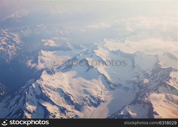 Aerial view from aircraft flying in high altitude. Landscape from above.
