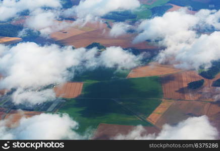 Aerial view from aircraft flying in high altitude. Landscape from above.