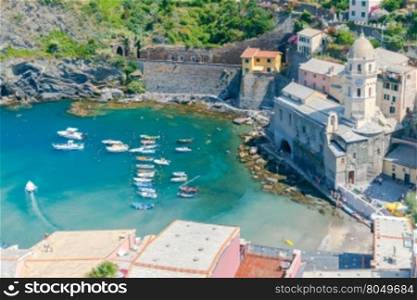 Aerial view from the hill of the old harbor in the village Vernazza. Cinque Terre National Park, Liguria, Italy.