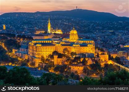 Aerial view illuminated Budapest Castle at sunset, Hungary. Aerial view illuminated Budapest Castle at sunset in Hungary