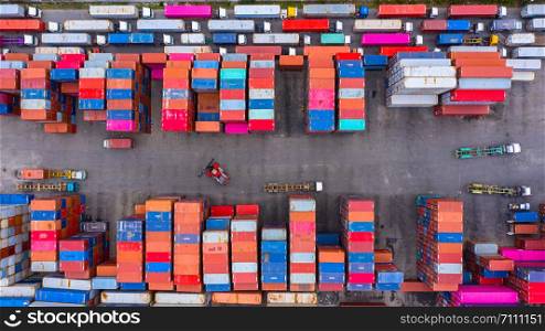 Aerial view industrial containers box from cargo freight ship for import and export in shipping yard with cargo container stack.