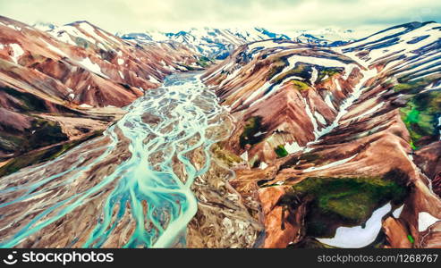 Aerial view landscape of Landmannalaugar surreal nature scenery in highland of Iceland, Europe. Beautiful colorful snow mountain terrain famous for summer trekking adventure and outdoor walking.