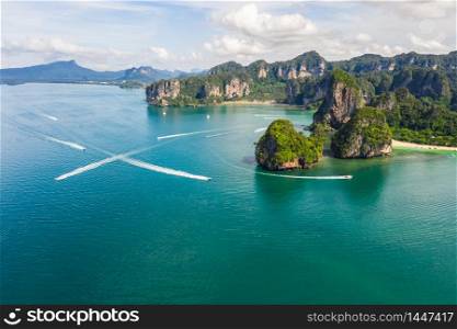 aerial view limestone and passenger boat at rairay and aonang beach in the tourist season of Krabi Thailand