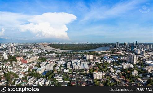 aerial view modern building business in city and big blue cloudy sky with transportation both road and river as panorama background