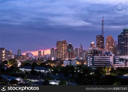 aerial view modern building business in city at dusk and sunset as silhouette background