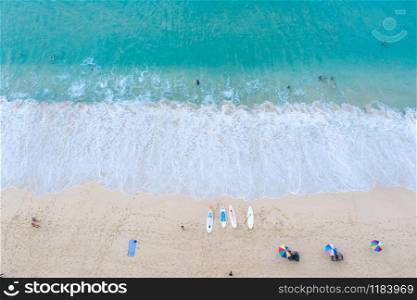 aerial view nature landscape ocean wave foam on the sand beach and travel tourists at surin beach Phuket Thailand