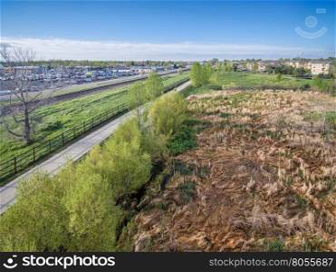 aerial view of a bike trail, railroad and green areas in Fort Collins, Colorado, spring scenery